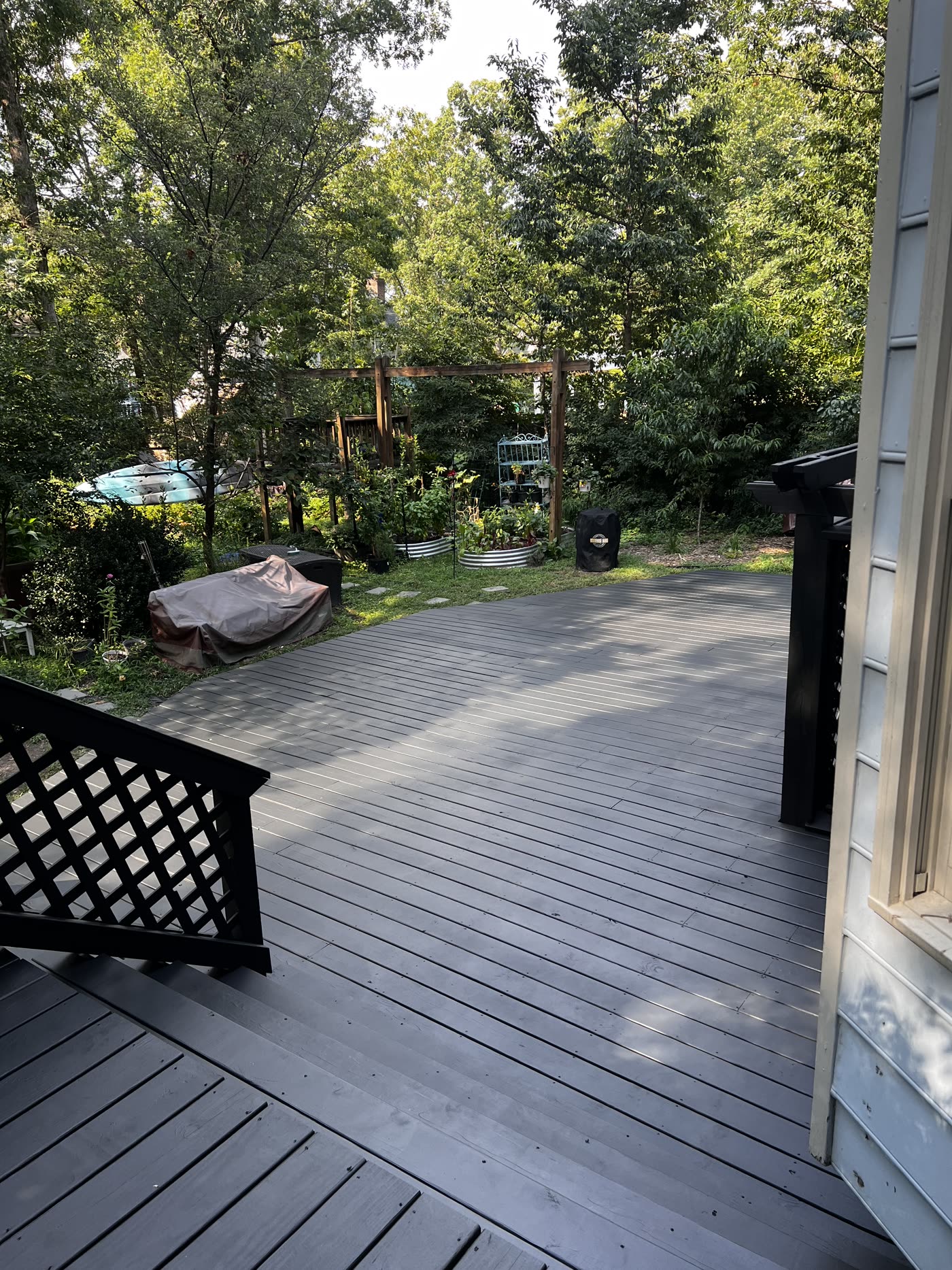 Deck Craft crew's finished deck surface leading into a landscaped Richmond backyard